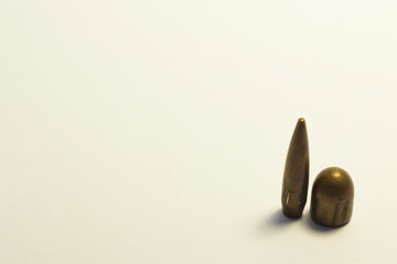 Bullet with a bullet lying on a white background