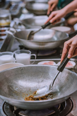 cooking thai food in a cooking class