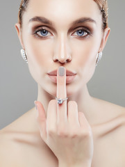 beautiful girl showing finger with wedding ring