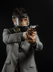 a man in a suit jacket with a gun posing as a special agent