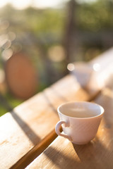 Obraz na płótnie Canvas cup waiting break coffe, outdoor light on table