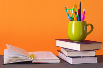 Back to school, books on the desk, education concept, open book on desk in the library room