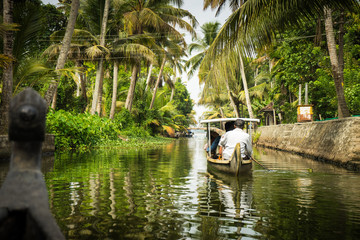 small boat on jungle river