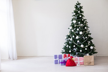 Christmas tree with presents in winter for the new year