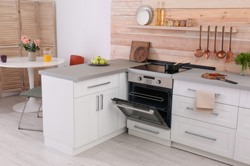 Light modern kitchen interior with new oven