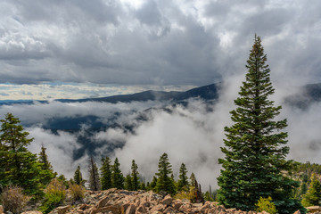 Clouds in valley from mountain ridge