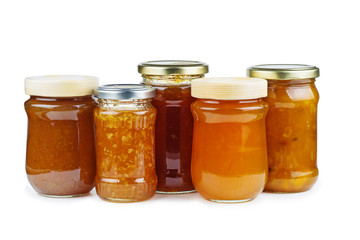 Homemade jam in glass jars isolated on white background