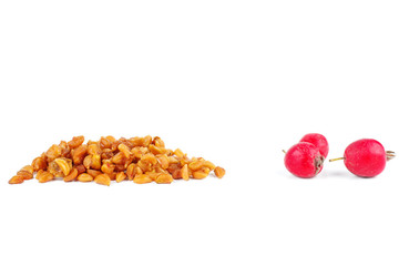 Hawthorn berries and pits isolated on white background