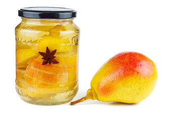 Sliced pears canned in glass jar isolated on white background