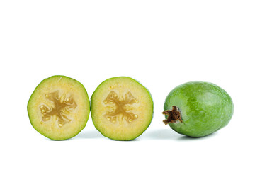 Whole and sliced feijoa fruits isolated on white background