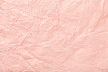 Crumpled pink wrapping paper, closrup.