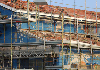 scaffolding of the construction site of a house during the works