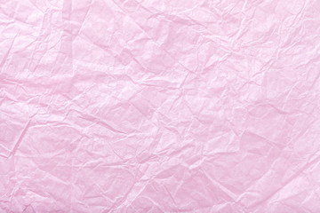 Crumpled pink wrapping paper, closrup.