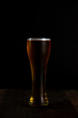 glass of beer on black background