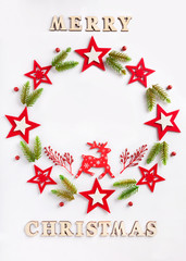 Fototapeta na wymiar New Year greeting card on white paper with an inscription Merry Christmas