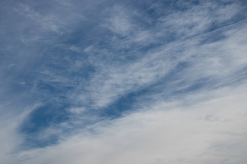 Fototapeta premium white cirrus clouds in the blue sky