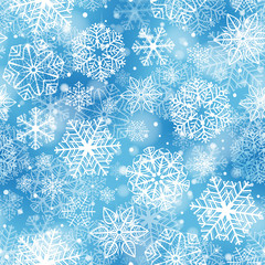 Snowflakes pattern. Seamless pattern with fluffy white snowflakes on soft blue background.