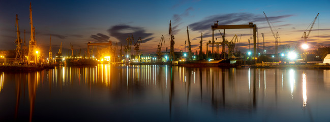 industrial areas, shipyard and port after sunset ,panorama- Szczecin, Poland