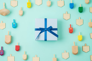 Jewish holiday Hanukkah background with gift box and spinning top