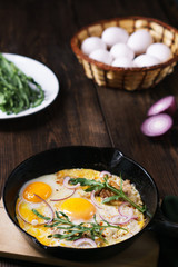 Healthy homemade cheap food, eggs and bacon in pan. Quick luncheon, home culinary