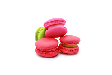 Colorful mini macarons isolated on white background.