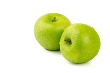 Macro shot of Fresh green apple with water drop isolated on white background.