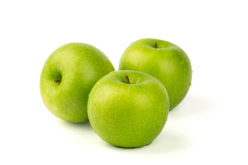 Macro shot of Fresh green apple with water drop isolated on white background.