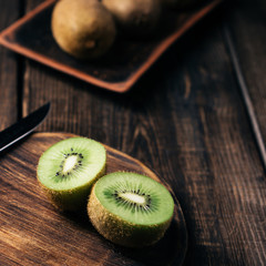 ripe kiwi fruits on plate, healthy eating, tropical fruits, food blog concept
