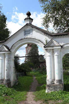 gate to the old cemetery, bell tower in the distance