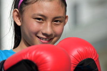 Female Athlete And Happiness Wearing Boxing Gloves