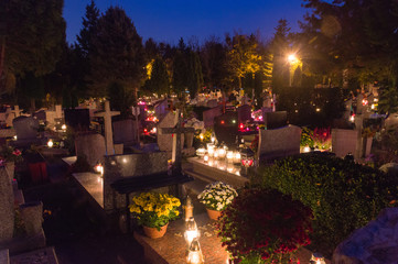Graves at Gdansk Lostowice cemetery at All Saints Day at night.