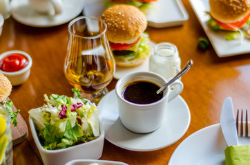 mini burgers with meat, vegetables, cheese and other toppings, bread sprinkled with sesame seeds, mini fast food