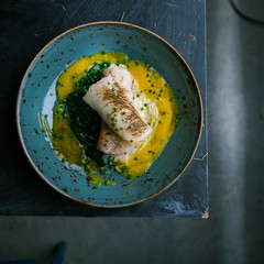 Grilled fish steak with vegetables dish from the restaurant