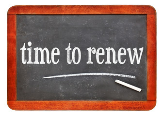 Obraz premium time to renew blackboard sign