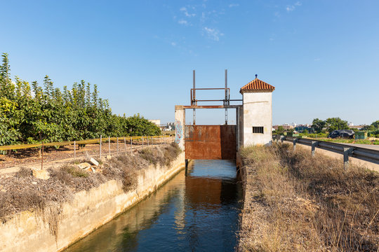 Acequia Real del Jucar - sluicegate of an irrigation watercourse canal at Benifaio, province of Valencia, Spain