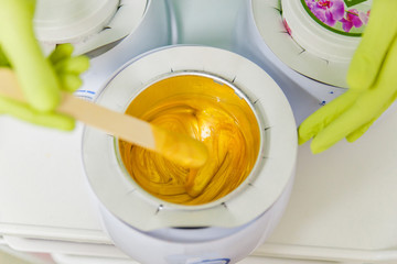 preparation for sugaring. heat up. stick. cosmetology center