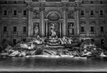 Beautiful Trevi Fountain at night, with Ocean god and tritons statues, completed in the 18th century in the historic center of Rome (Black and White)