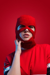 Alluring model in red knitted mask