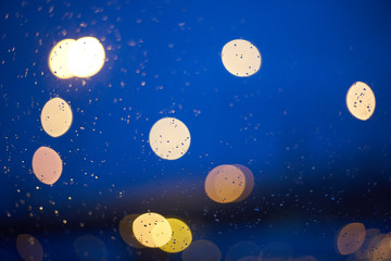 Blurred abstract background. defocused bokeh of evening road with lanterns