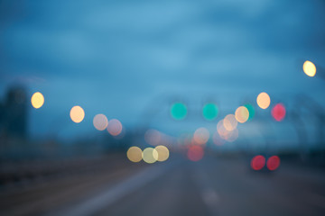 Blurred abstract background. defocused bokeh of evening road with lanterns