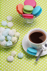 A cup of coffee and macaroons ready for breakfast