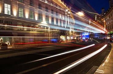 Fotobehang Londen rode bus night scene of London city United Kingdom with the moving red buses and cars - long exposure photography  