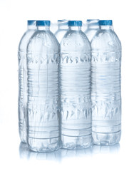 Plastic bottles water in wrapped package on white background
