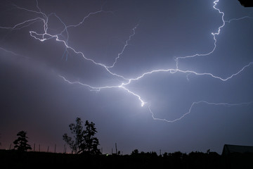 A lightningbolt creeps through the sky over Transylvania, Romania