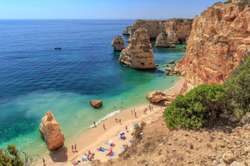 One of the worlds most beautiful beaches, the Praia da Marihna beach at the Algarve Coast in...