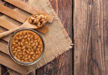 Salted soy beans paste on wood background,top view
