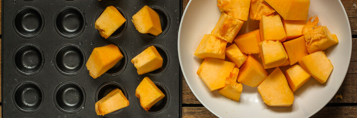 orange pumpkin (pieces of fresh pumpkin). Vegan food. Flat lay. Diet menu. Top view