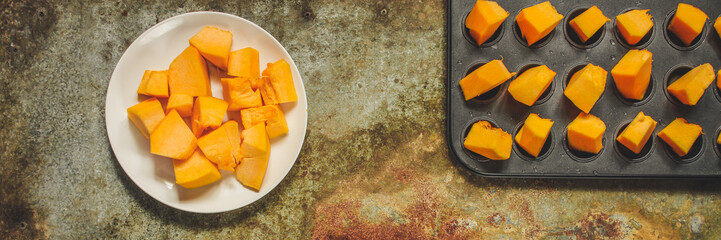 orange pumpkin (pieces of fresh pumpkin). Vegan food. Flat lay. Diet menu. Top view