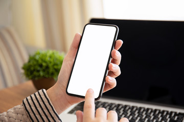 female hands holding touch phone with isolated screen in office