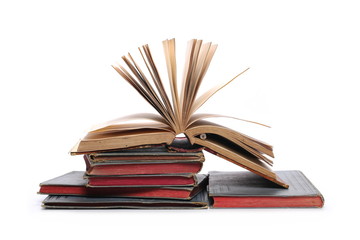 Stack of old antique big books isolated on white background